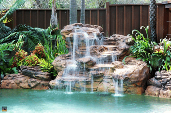 beautiful water feature by splash pools - custom pool builders in Glenn Heights